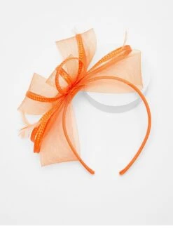 Quiz Orange Feather Loop Headband Fascinator